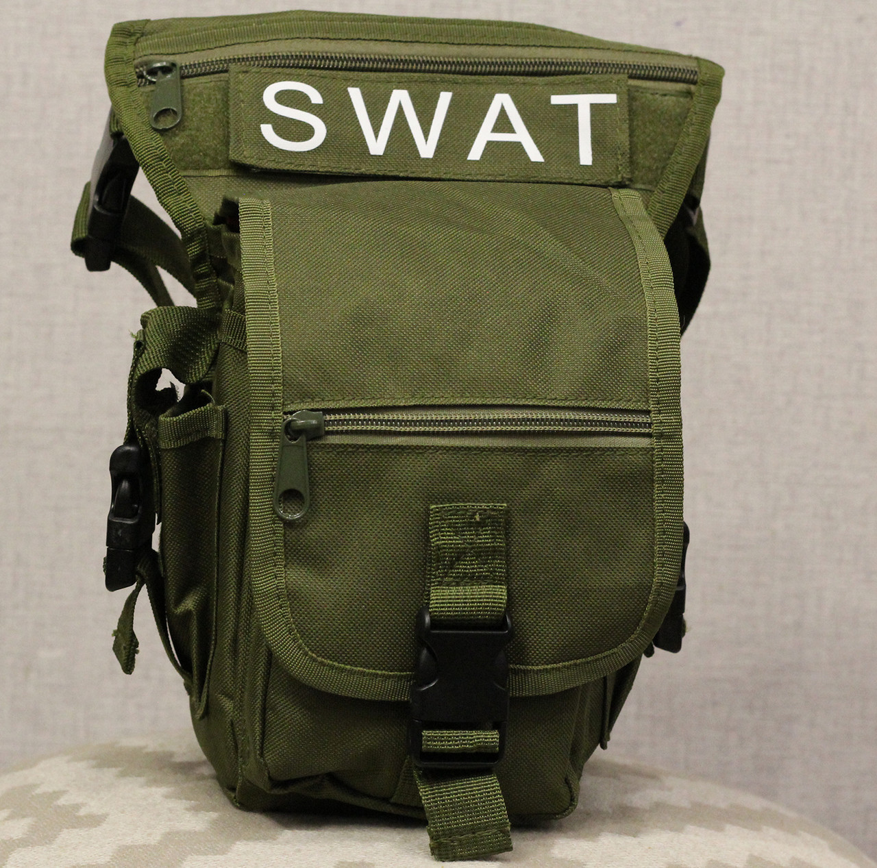Тактическая универсальная (набедренная) сумка на бедро Swat Olive ( 300-olive), Оливковый
Тактическая универсальная (набедренная) сумка на бедро Swat Olive ( 300-olive), Оливковый