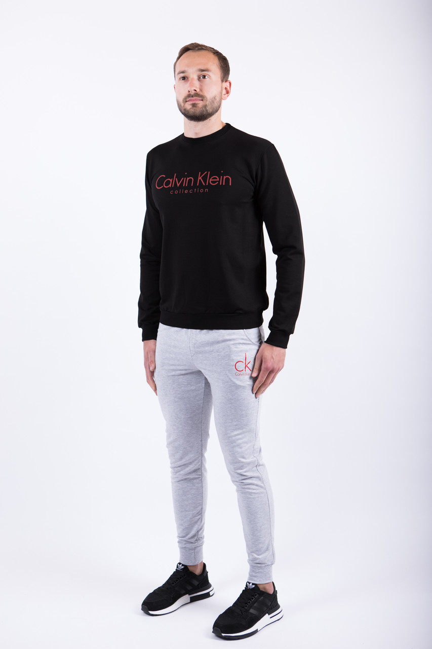 Мужской спортивный костюм чёрный свитшот с принтом "Calvin Klein" и меланжевые штаны с принтом "Calvin Klein", Черный с серым и красным
Мужской спортивный костюм чёрный свитшот с принтом "Calvin Klein" и меланжевые штаны с принтом "Calvin Klein", Черный с серым и красным
