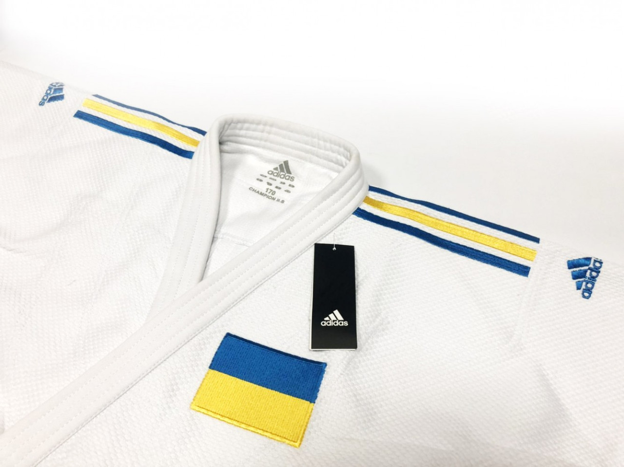 Кимоно для дзюдо Adidas Champion II IJF Slim Fit UA White: продажа, цена в  Киеве. одежда для боевых искусств от "Интернет-магазин SportsTrend" -  1015276443