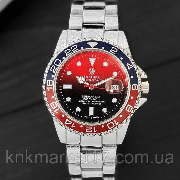 silver and red rolex