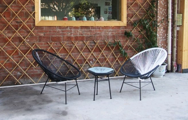 Купити дизайнерське крісло плетенное з ротанга у вітальню